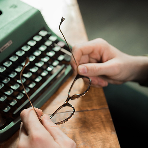 typewriter and glasses